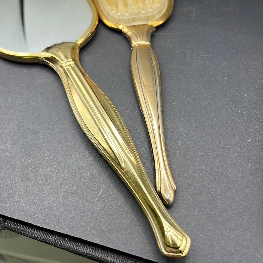 Vintage vanity hand mirror and brush